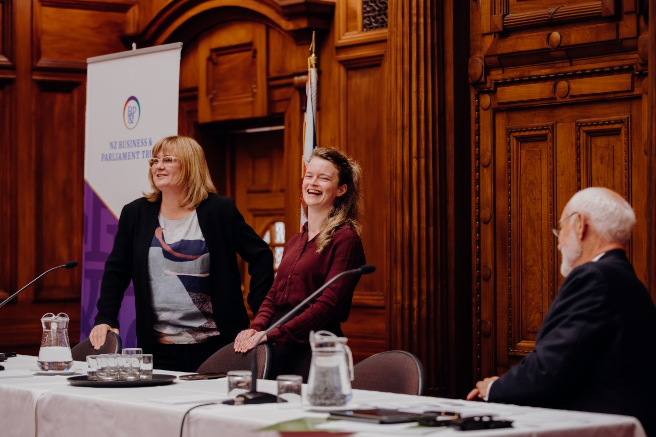 Gia Garrick and Beth Houston laughing with Board Chair at a topic