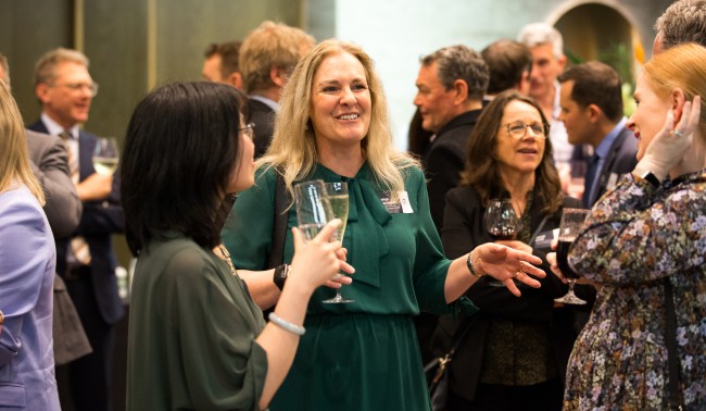 Guests networking and talking with each other during Auckland stakeholder's event